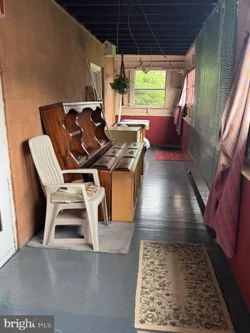 a kitchen with stainless steel appliances granite countertop a stove refrigerator a sink dishwasher with a dining table and chair with wooden floor