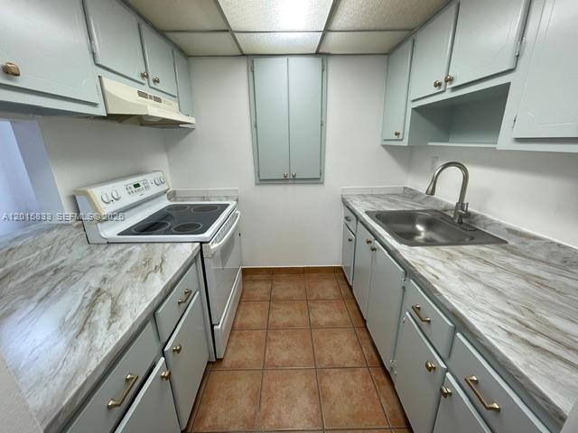 10112 Southwest 20th Street Miami, FL 33165 - Photo 4 of 10 a kitchen with stainless steel appliances granite countertop a sink and stove