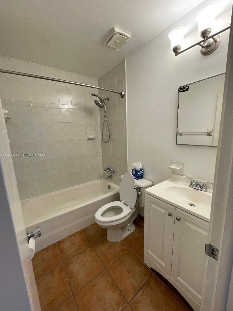 10112 Southwest 20th Street Miami, FL 33165 - Photo 5 of 10 a bathroom with a sink a toilet and shower