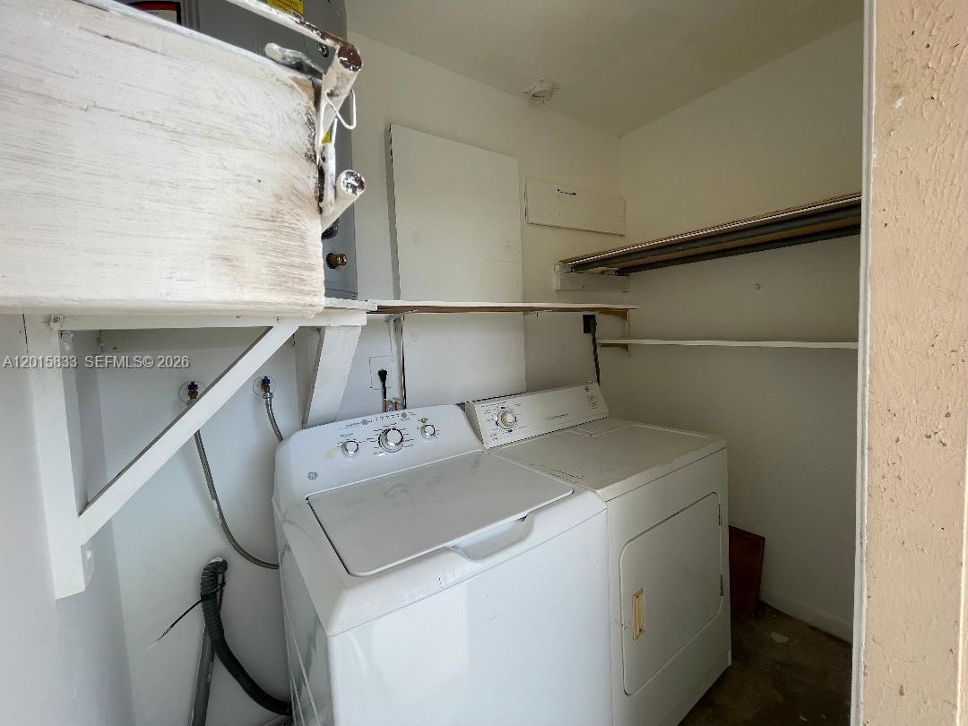 10112 Southwest 20th Street Miami, FL 33165 - Photo 7 of 10 a utility room with dryer and washer