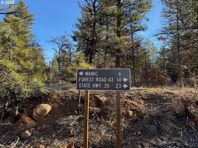 a view of a wooden door with a bench