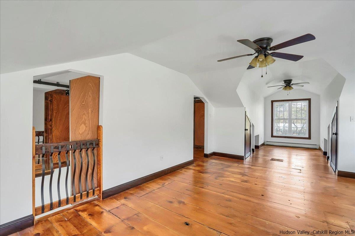 57 Tow Path Wawarsing, NY 12489 - Photo 19 of 28 a view of livingroom with hardwood floor and a ceiling fan