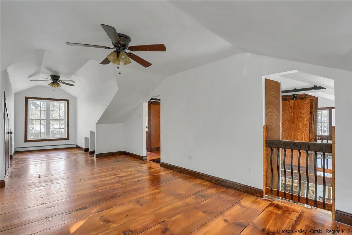 57 Tow Path Wawarsing, NY 12489 - Photo 24 of 28 a view of an empty room with window and wooden floor