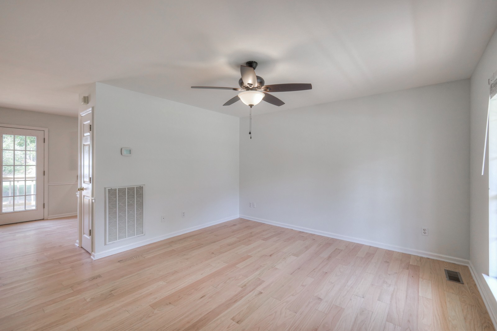7195 Chester Road Fairview, TN 37062 - Photo 13 of 32 wooden floor in an empty room with a window