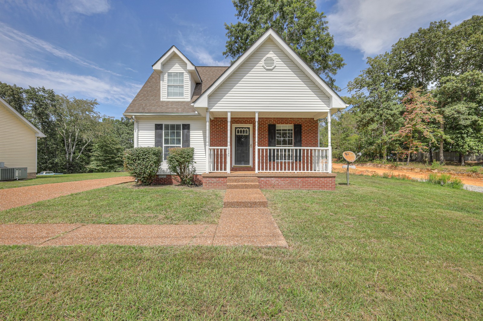 7195 Chester Road Fairview, TN 37062 - Photo 3 of 32 a front view of a house with a yard