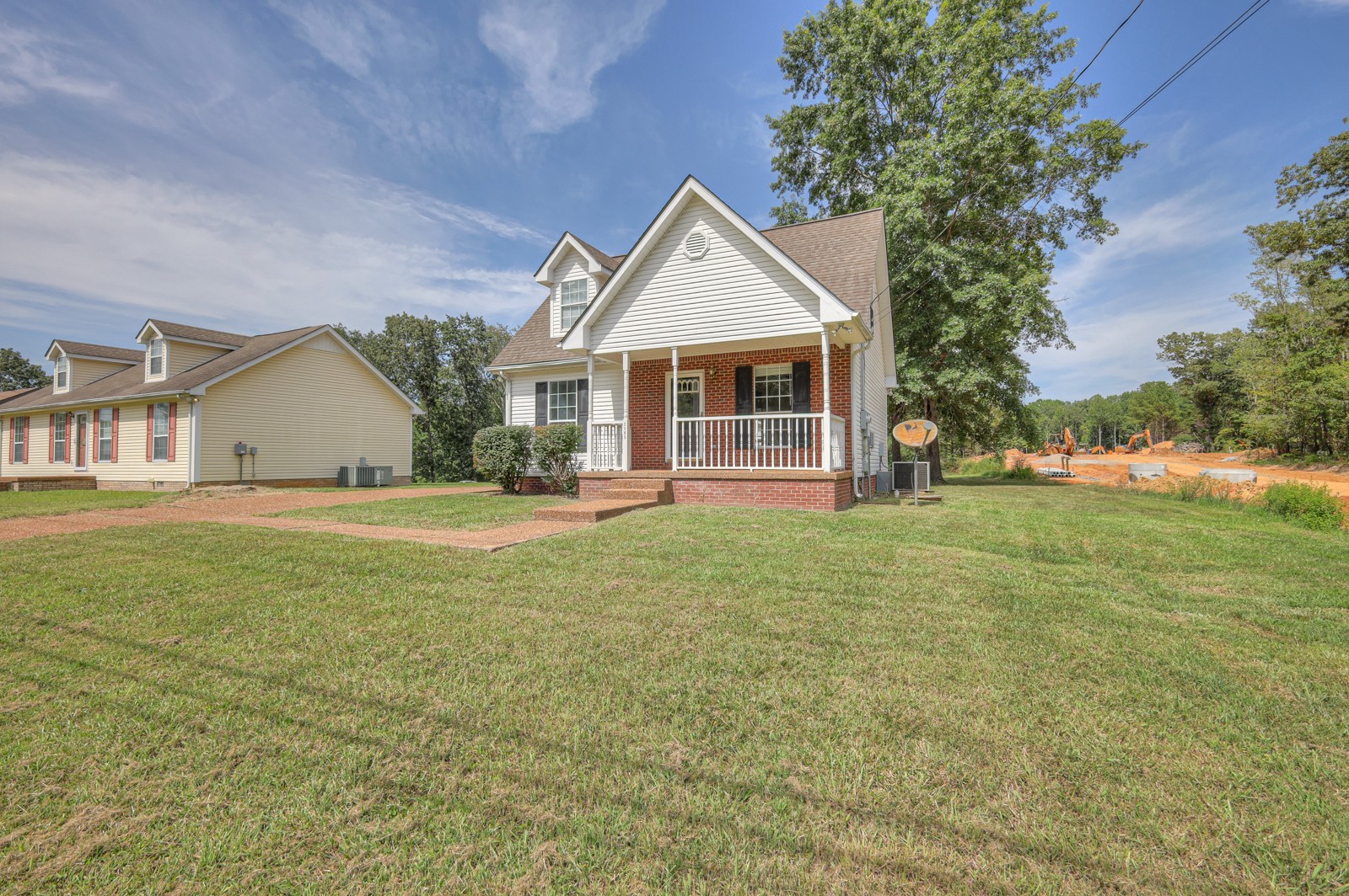 7195 Chester Road Fairview, TN 37062 - Photo 4 of 32 a front view of house with yard and green space