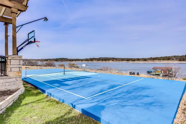 a small pool with buildings in the background