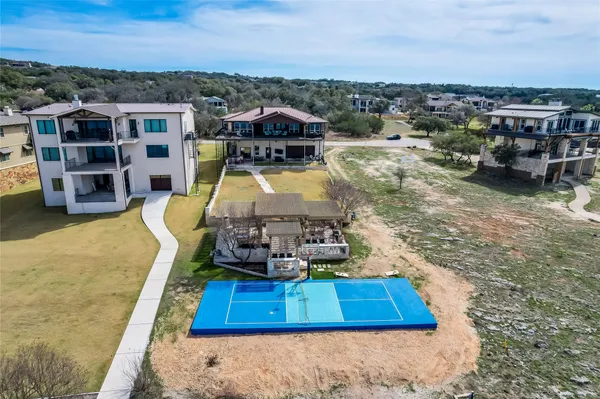 an aerial view of residential house with outdoor space and parking