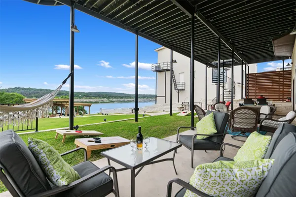 a view of a patio with a table chairs and a table