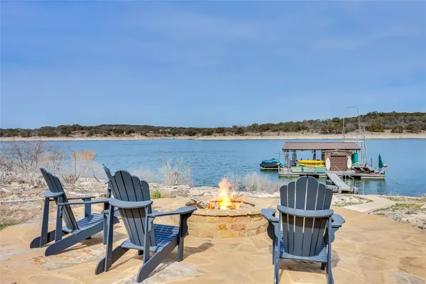 a view of a balcony with table and chairs