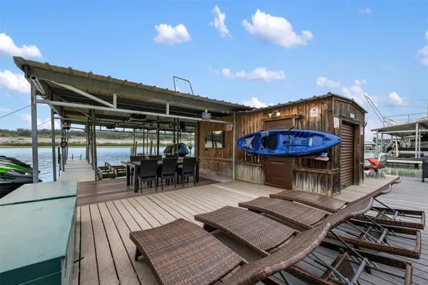 a view of a chairs and table in the patio