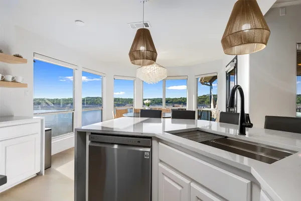 a spacious bedroom with a large bed and a large window