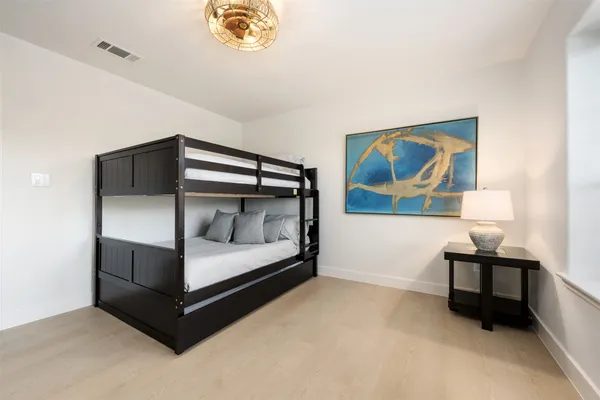 a bedroom with bed and window