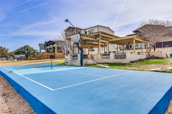 a living room with fireplace furniture and a flat screen tv