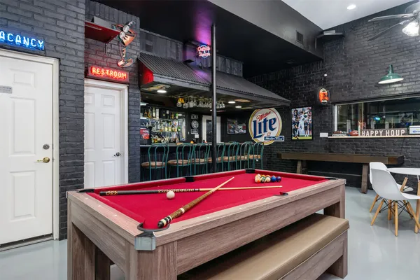 a view of a dining area with furniture and chandelier
