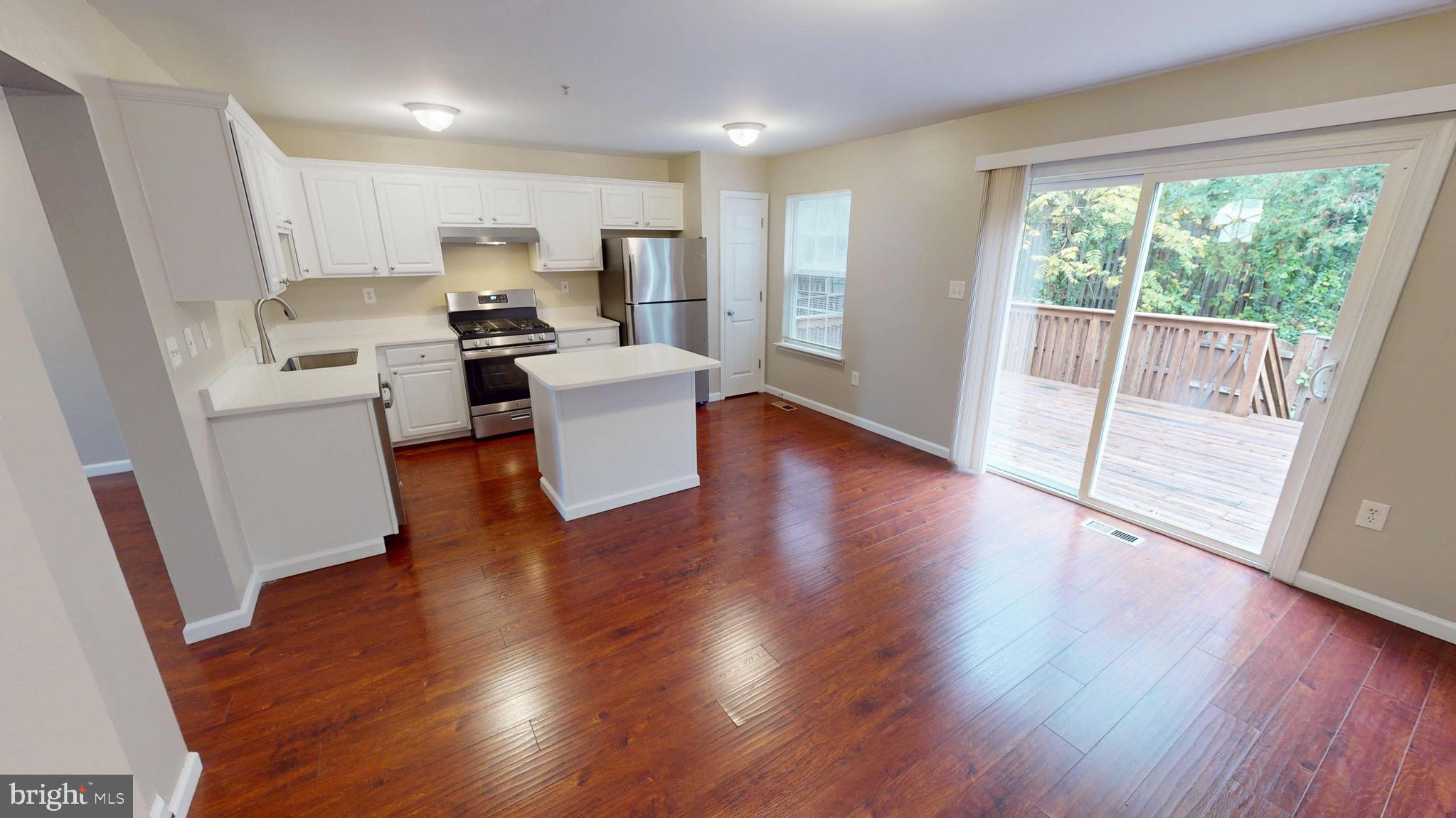 10611 Riva Place White Plains, MD 20695 - Photo 26 of 93 a view of kitchen with sink and wooden floor