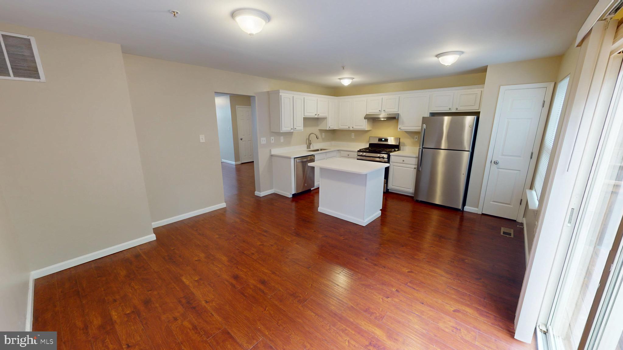 10611 Riva Place White Plains, MD 20695 - Photo 27 of 93 a view of kitchen with refrigerator sink and stove