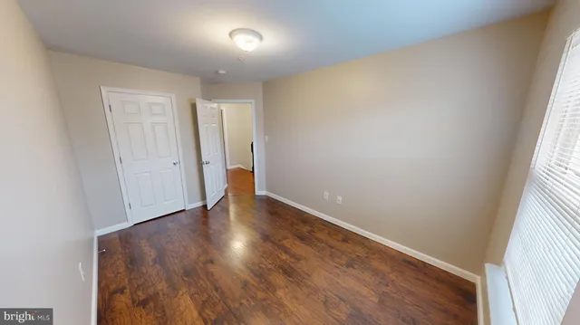 a view of a hallway with seating area