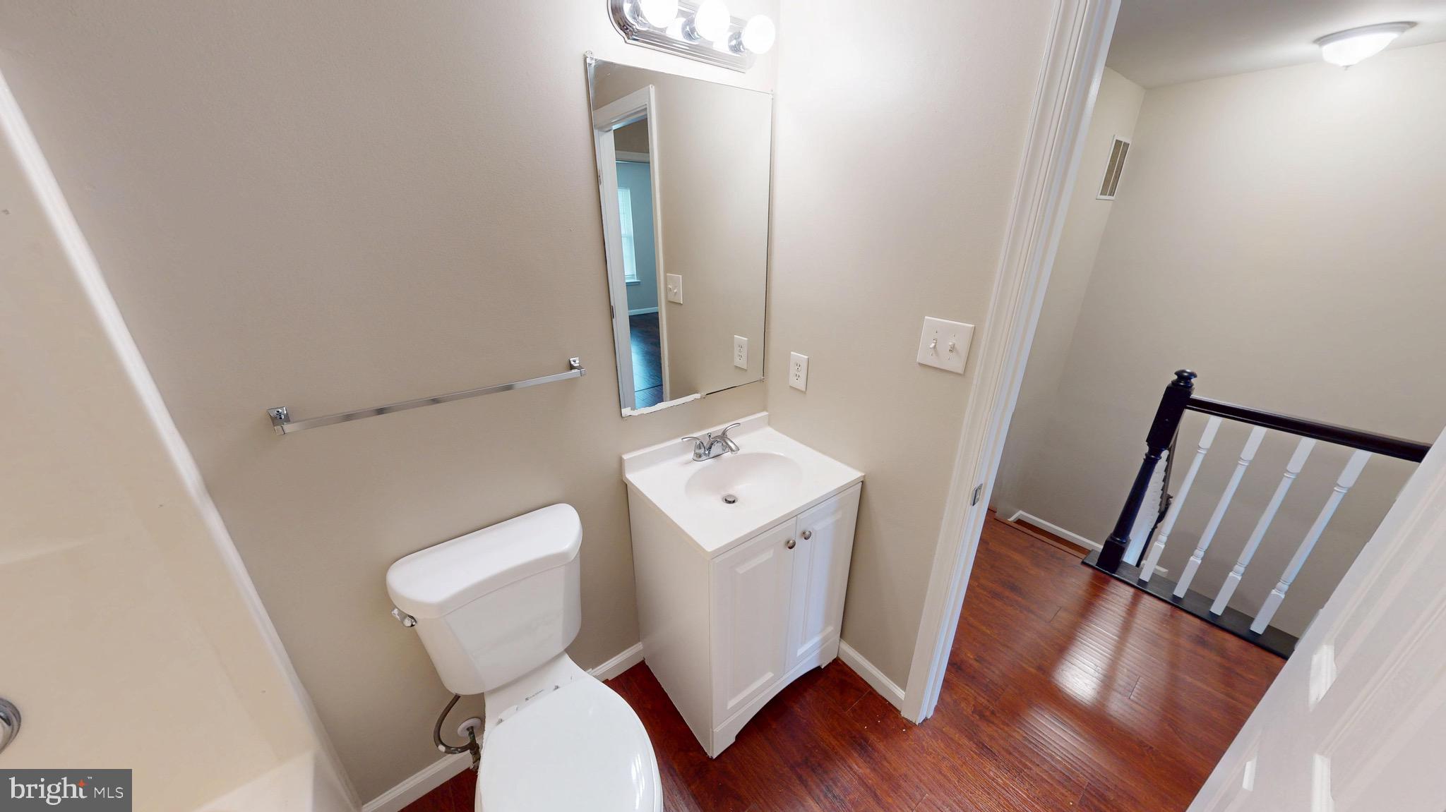 10611 Riva Place White Plains, MD 20695 - Photo 57 of 93 a white toilet sitting next to a white sink