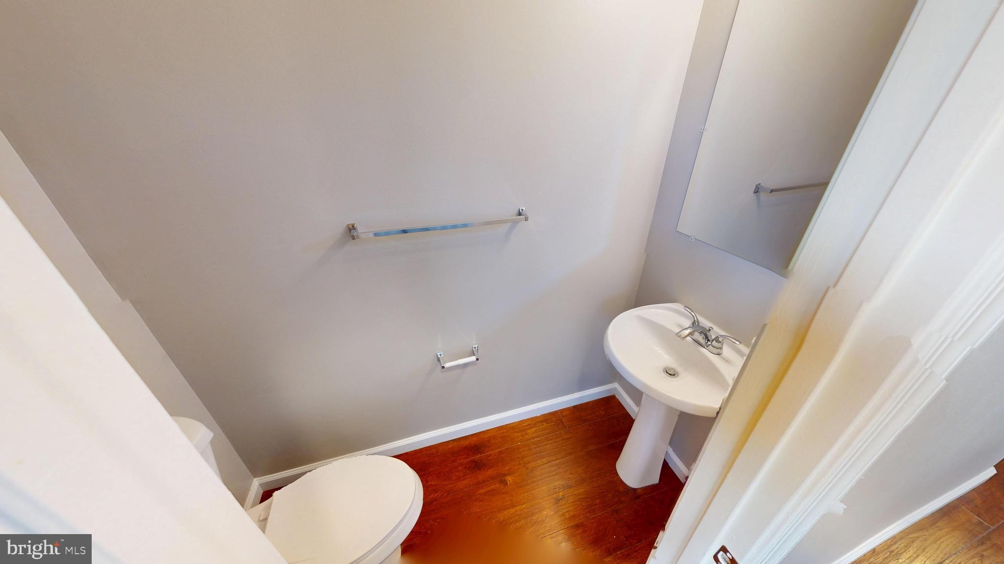 10611 Riva Place White Plains, MD 20695 - Photo 6 of 93 a bathroom with a toilet and sink