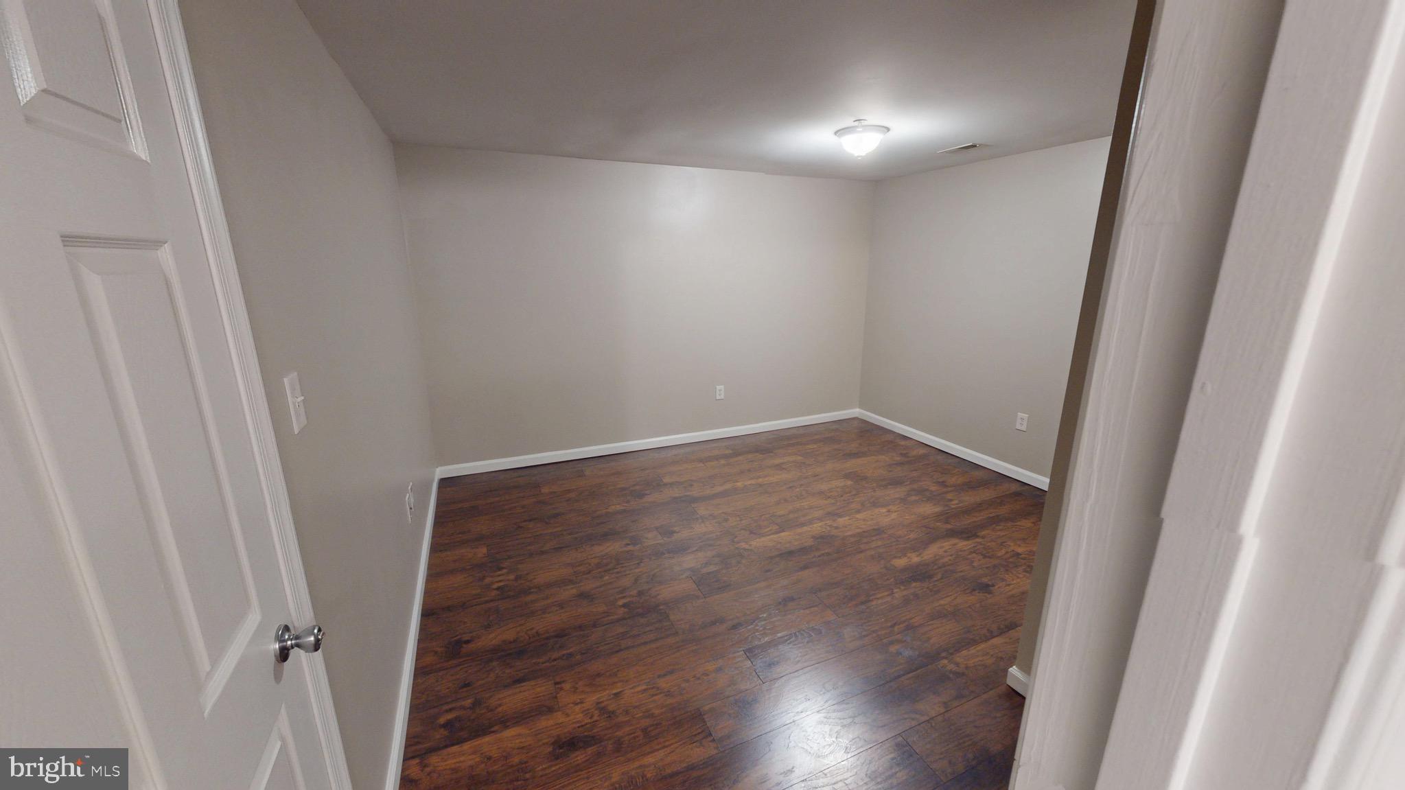 10611 Riva Place White Plains, MD 20695 - Photo 79 of 93 a view of hallway with wooden floor
