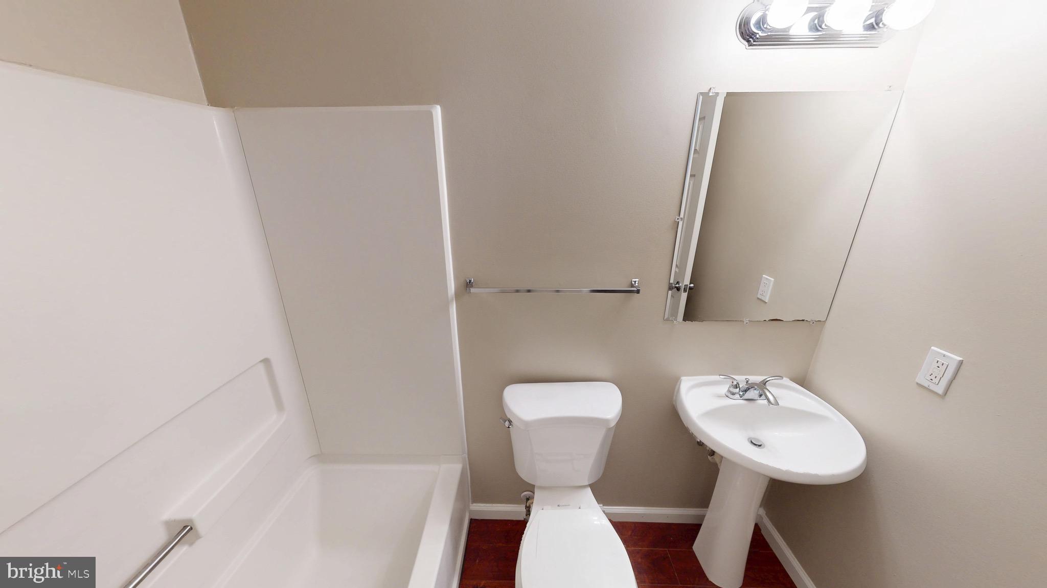 10611 Riva Place White Plains, MD 20695 - Photo 81 of 93 a bathroom with a sink and a mirror