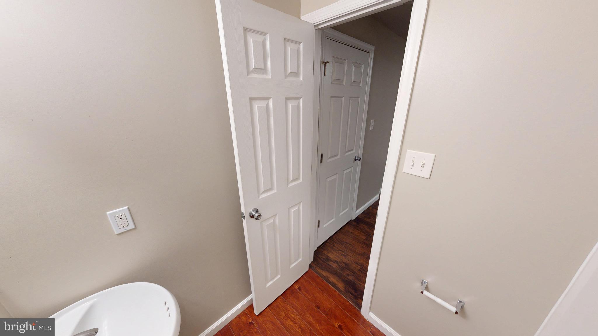 10611 Riva Place White Plains, MD 20695 - Photo 84 of 93 a view of a room with wooden floor and white walls
