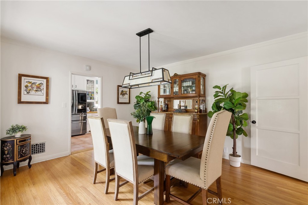 2014 North Flower Street Santa Ana, CA 92706 - Photo 11 of 28 a view of a dining room with furniture window and wooden floor