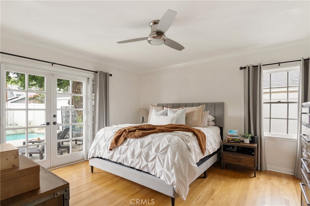 2014 North Flower Street Santa Ana, CA 92706 - Photo 17 of 28 a bedroom with a bed and wooden floor