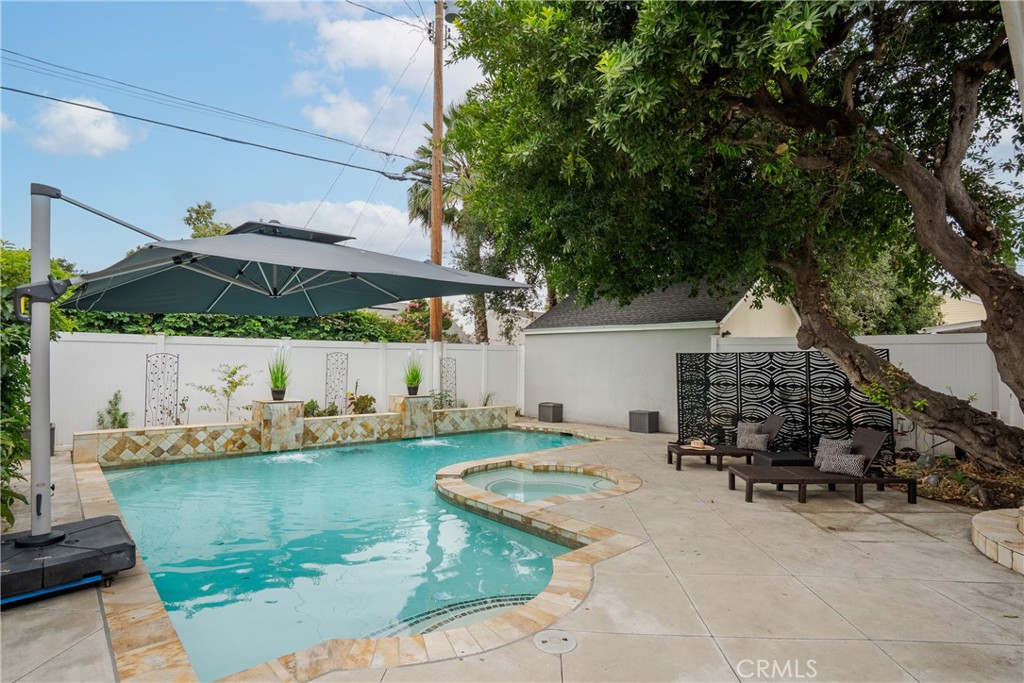 2014 North Flower Street Santa Ana, CA 92706 - Photo 24 of 28 a view of a house with backyard porch and sitting area