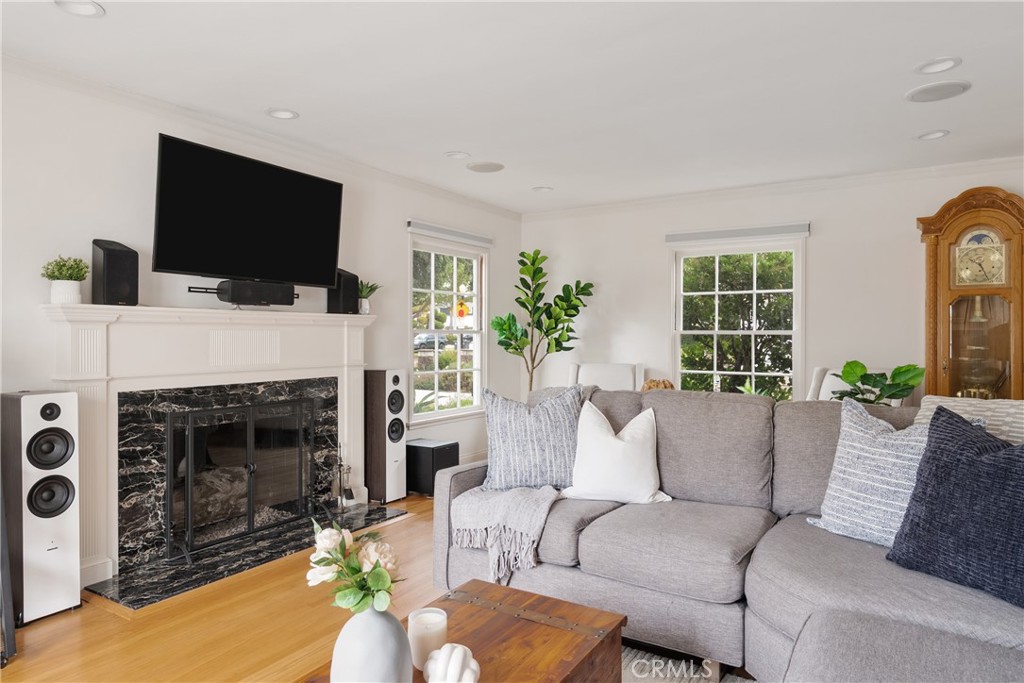 2014 North Flower Street Santa Ana, CA 92706 - Photo 7 of 28 a living room with furniture a fireplace and a flat screen tv