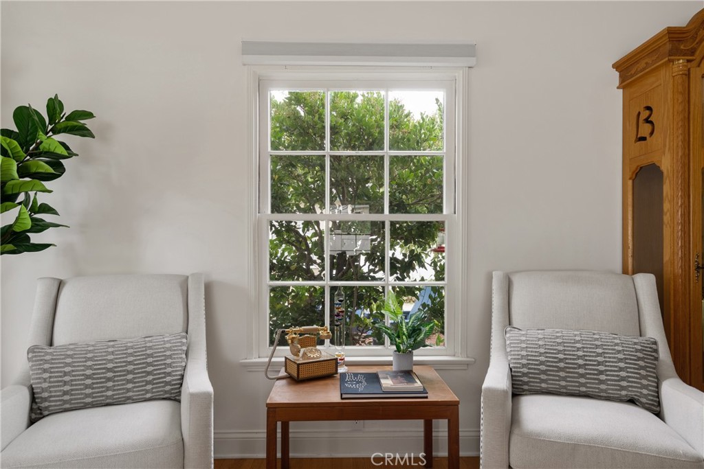 2014 North Flower Street Santa Ana, CA 92706 - Photo 8 of 28 a room with a couch and a potted plant