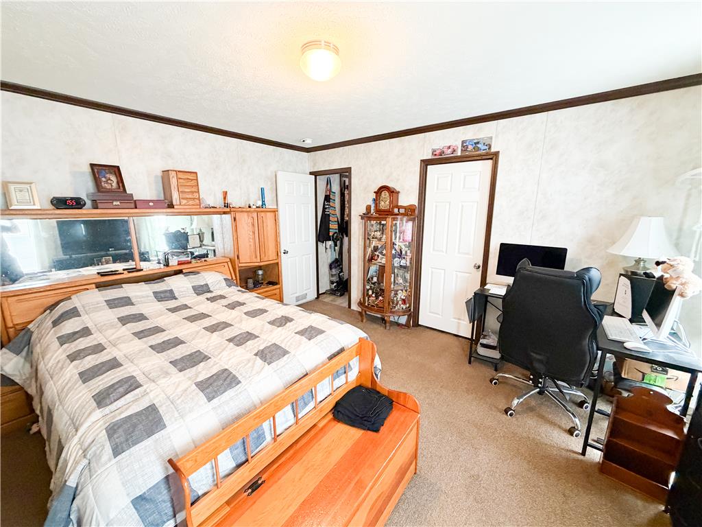 49 Ritz Craft Street Walnutport, PA 18088 - Photo 13 of 17 Step into a comfortable bedroom featuring practical built-in storage and soft carpeting.