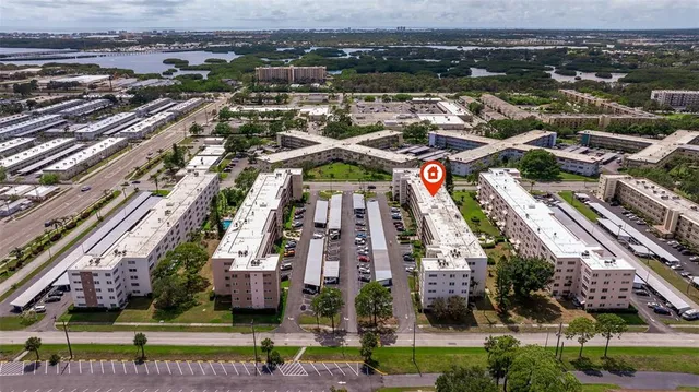 an aerial view of a building with yard
