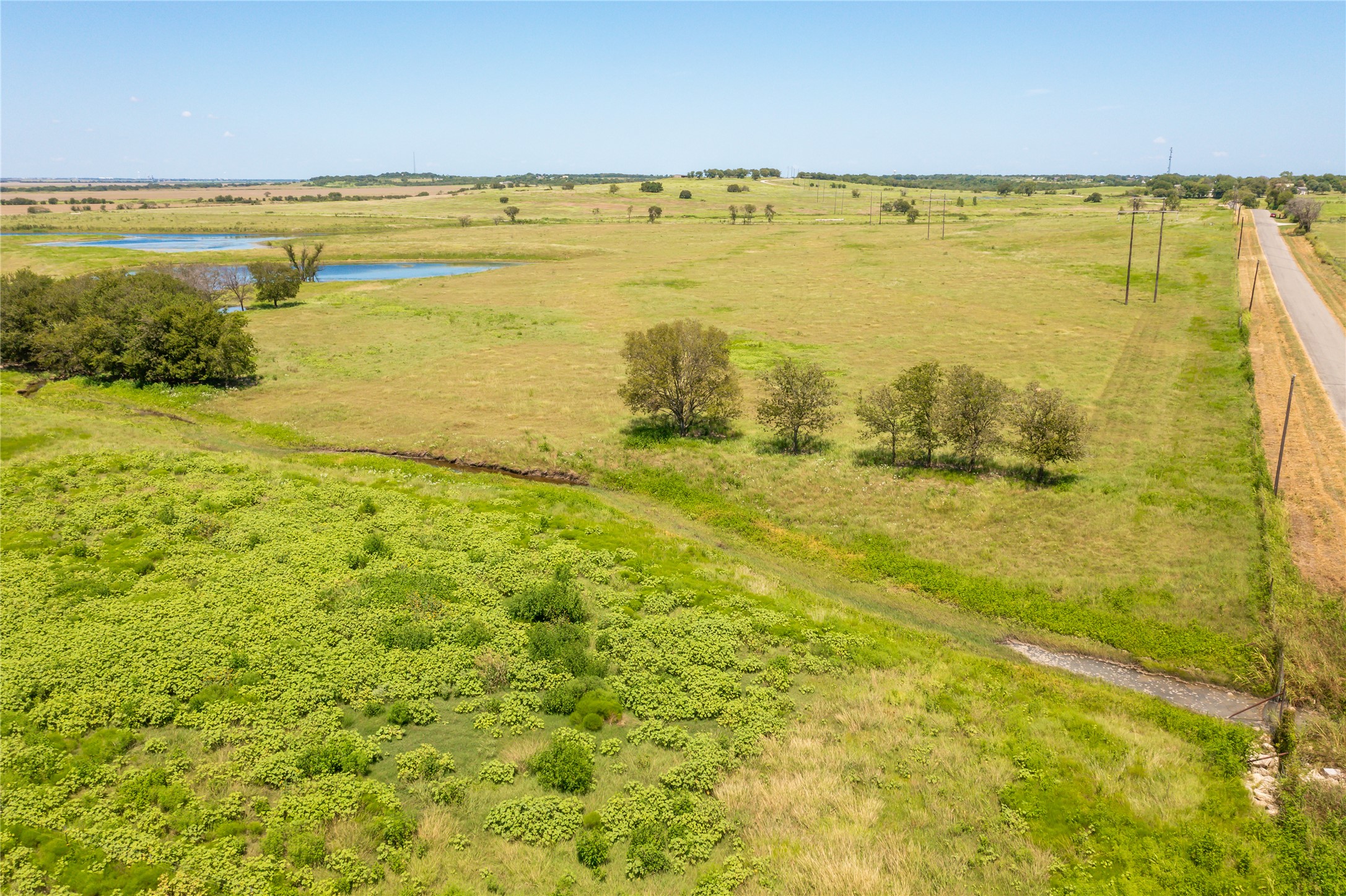 Lot 4 Wall Ridge Road Moody, TX 76557 - Photo 12 of 22 Aerial view of sparsely populated area featuring a nearby body of water