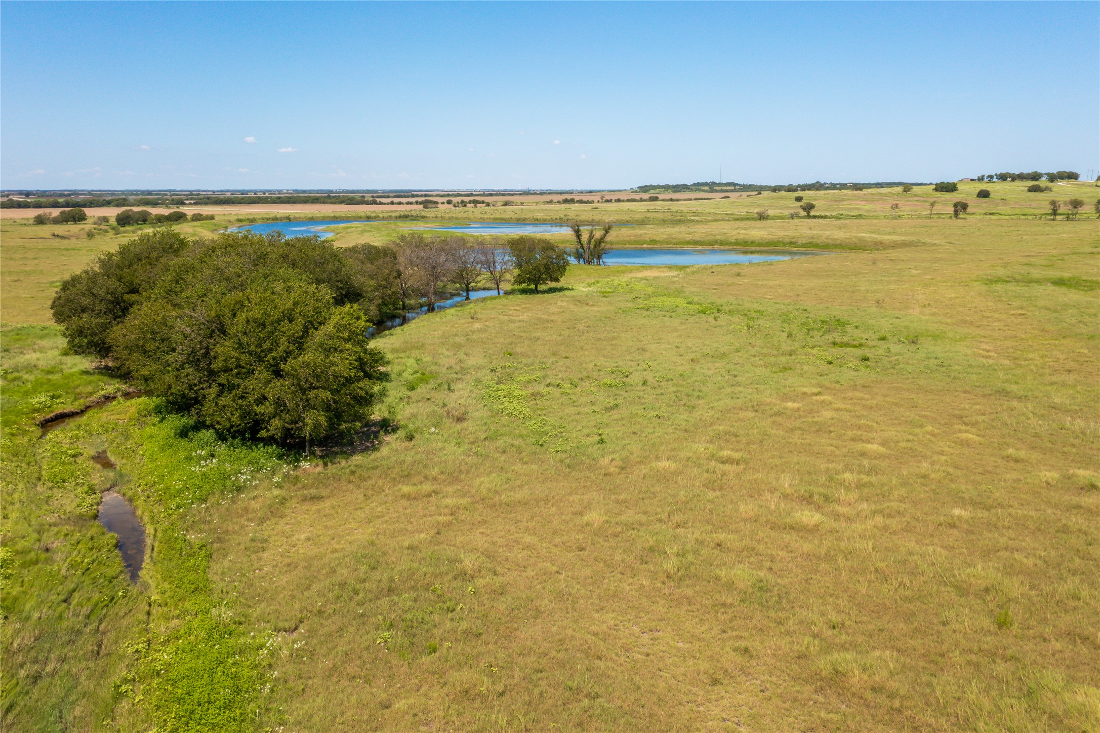 Lot 4 Wall Ridge Road Moody, TX 76557 - Photo 14 of 22 Aerial view of sparsely populated area with a nearby body of water