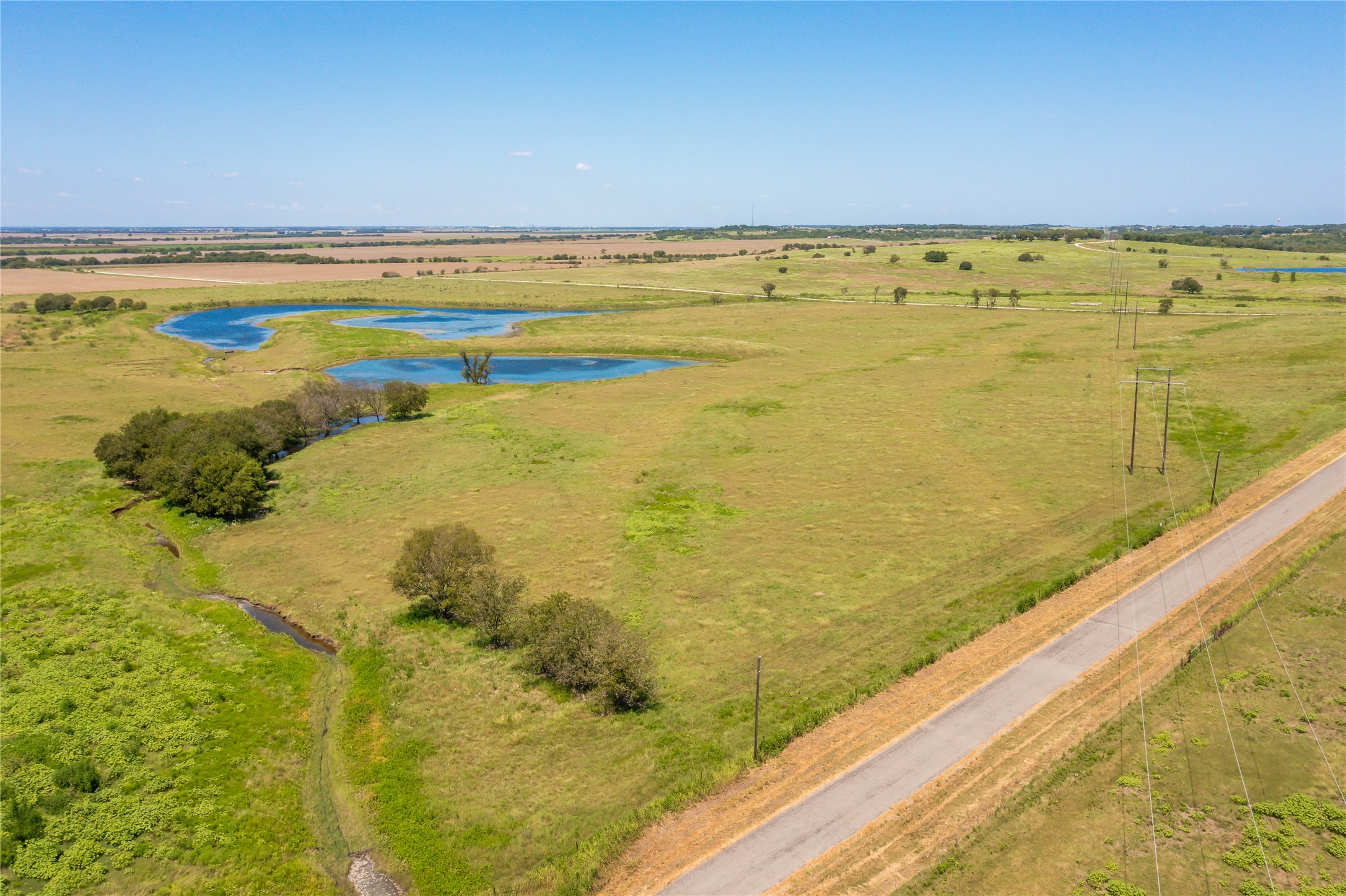 Lot 4 Wall Ridge Road Moody, TX 76557 - Photo 2 of 22 Overview of rural landscape with a nearby body of water