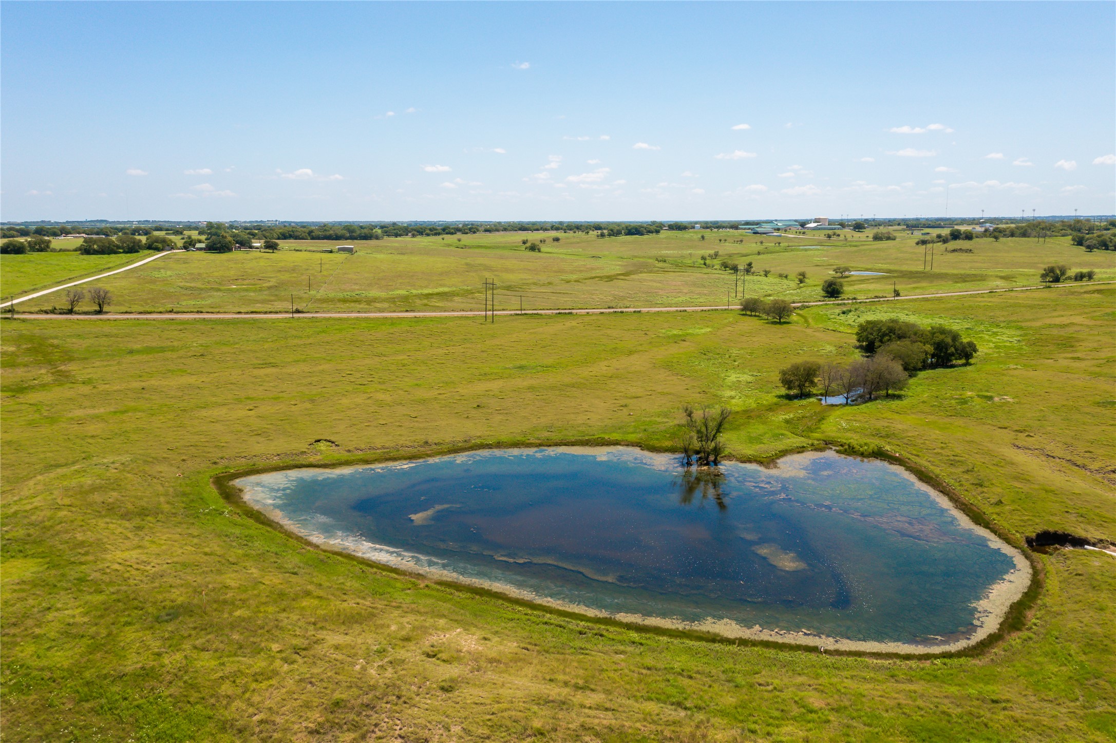 Lot 4 Wall Ridge Road Moody, TX 76557 - Photo 5 of 22 Aerial view of sparsely populated area featuring a large body of water and a pastoral area