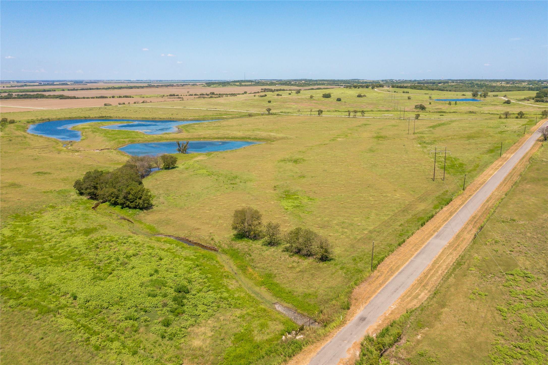 Lot 4 Wall Ridge Road Moody, TX 76557 - Photo 10 of 22 Aerial view of sparsely populated area featuring a nearby body of water