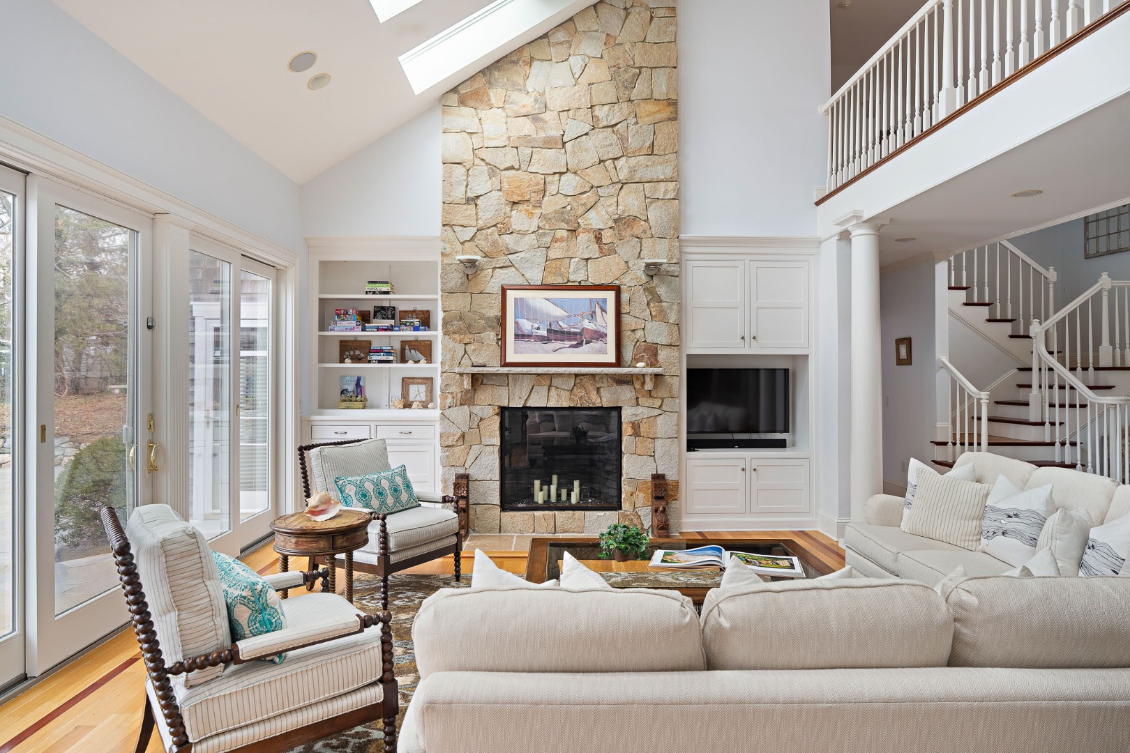385 Barnes Road Oak Bluffs, MA 02557 - Photo 13 of 60 a living room with furniture and a fireplace