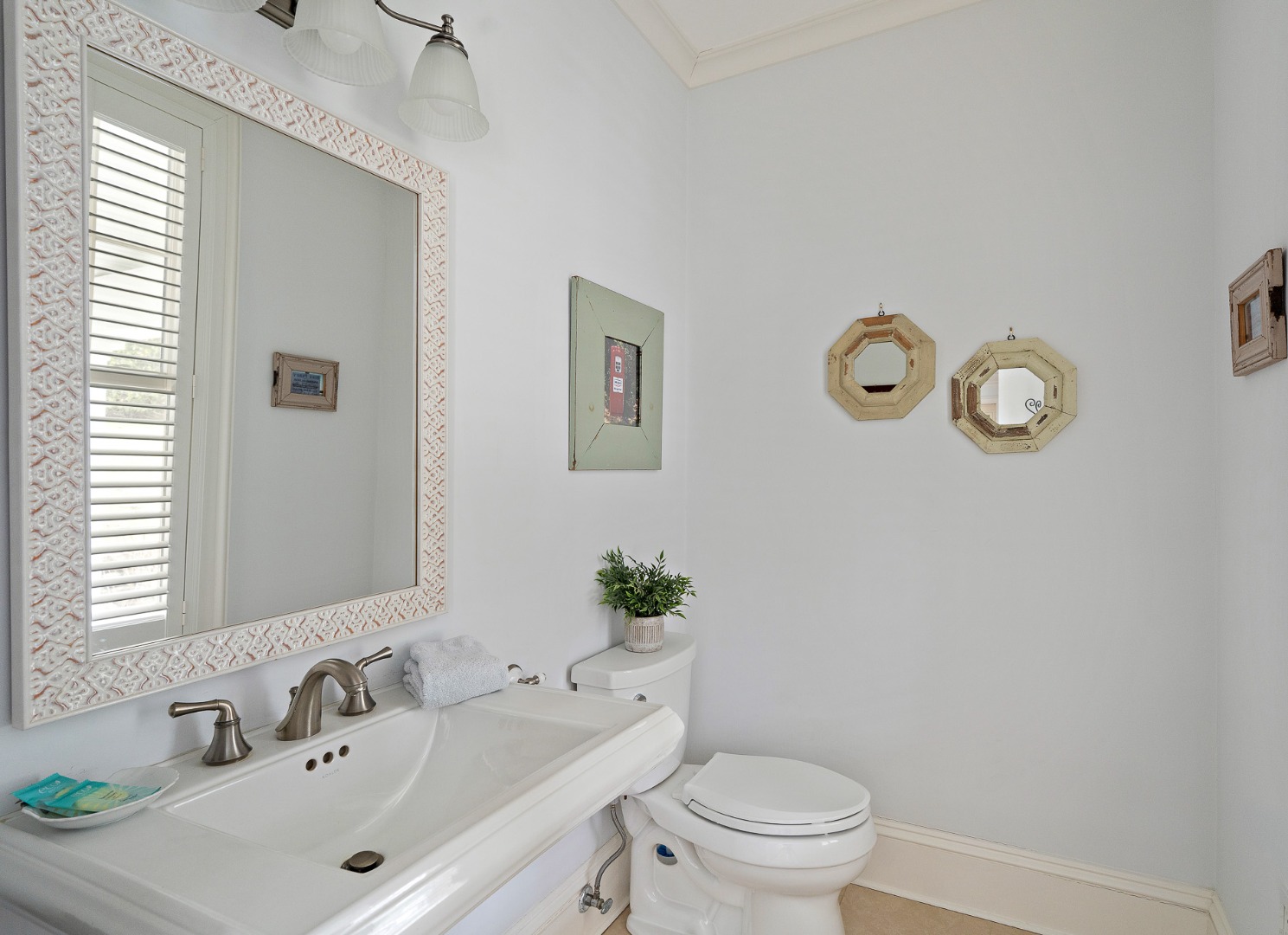 385 Barnes Road Oak Bluffs, MA 02557 - Photo 14 of 60 a bathroom with a sink mirror vanity and toilet