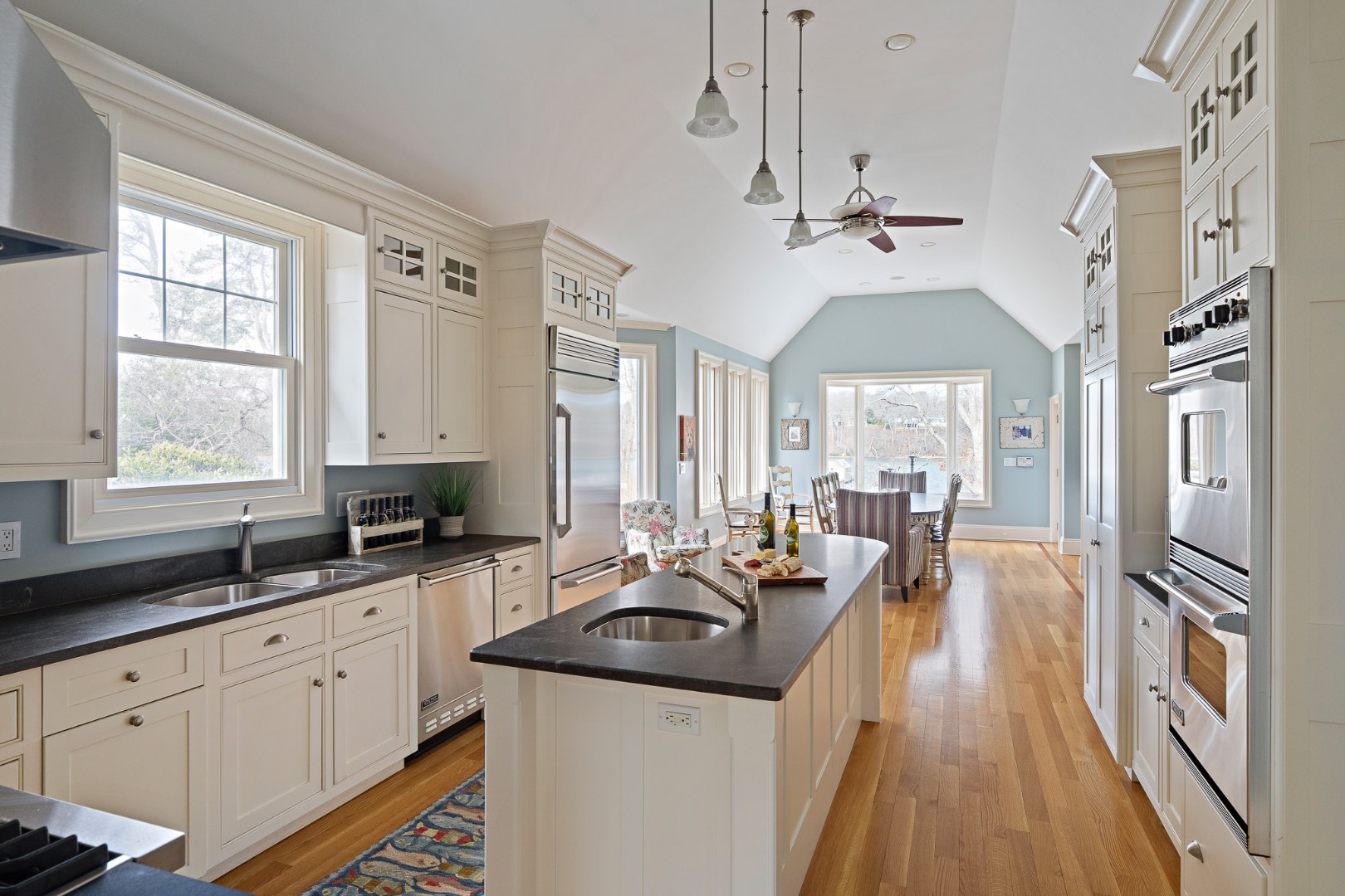 385 Barnes Road Oak Bluffs, MA 02557 - Photo 15 of 60 a kitchen with granite countertop a sink stove and cabinets