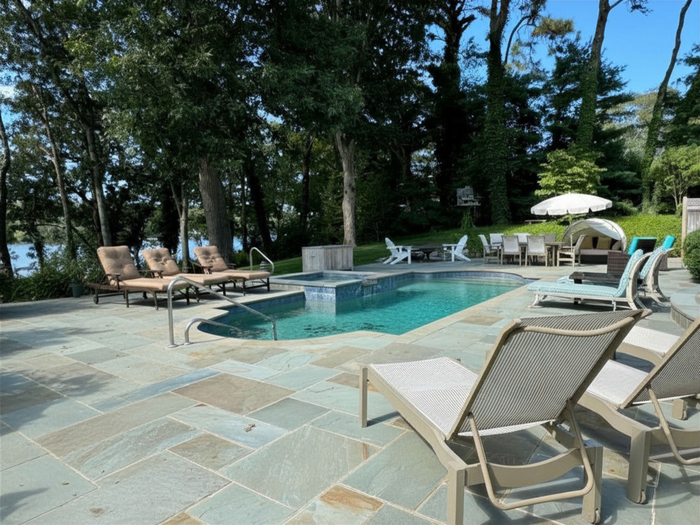 385 Barnes Road Oak Bluffs, MA 02557 - Photo 2 of 60 a view of a patio with chairs and tables