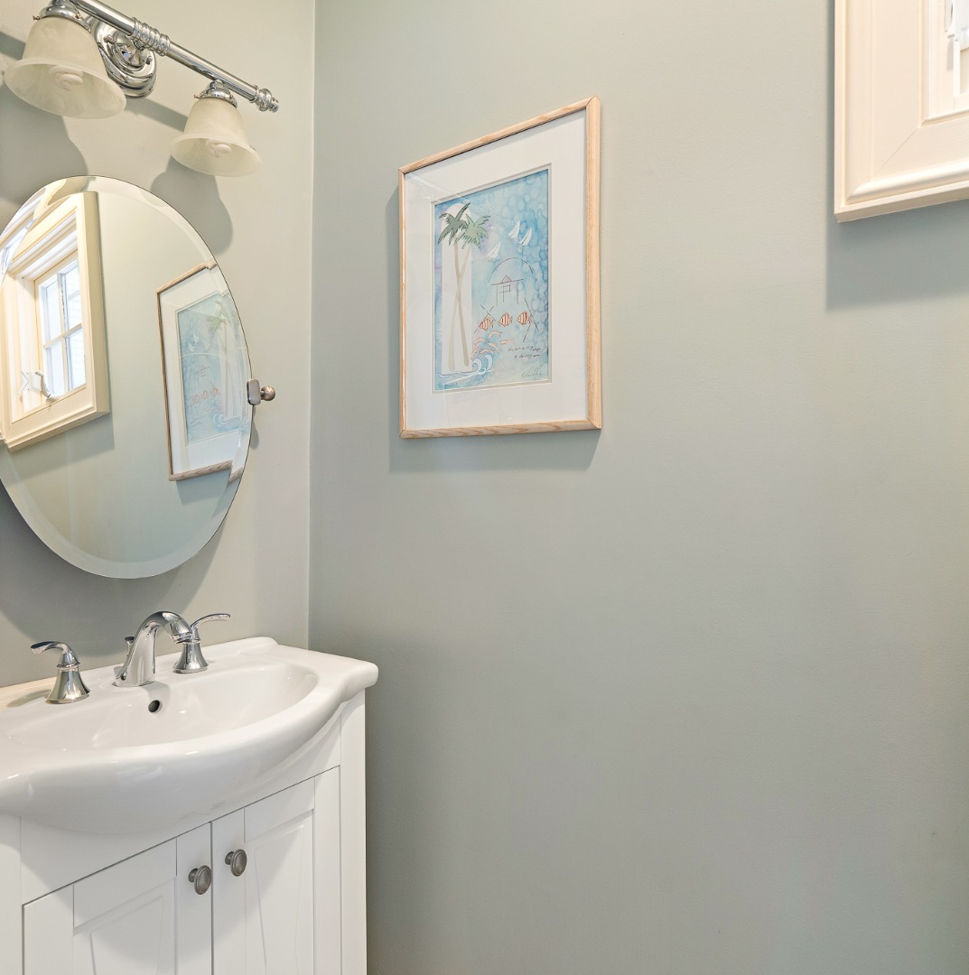 385 Barnes Road Oak Bluffs, MA 02557 - Photo 22 of 60 a bathroom with a sink and a mirror