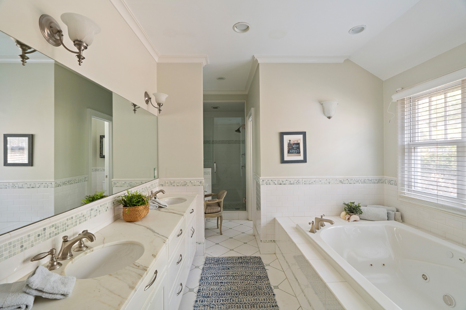 385 Barnes Road Oak Bluffs, MA 02557 - Photo 31 of 60 a bathroom with a tub sink and mirror