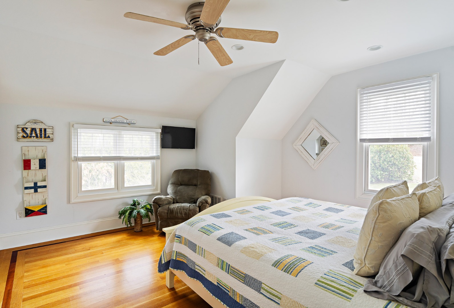 385 Barnes Road Oak Bluffs, MA 02557 - Photo 37 of 60 a bed sitting in a bedroom next to a window
