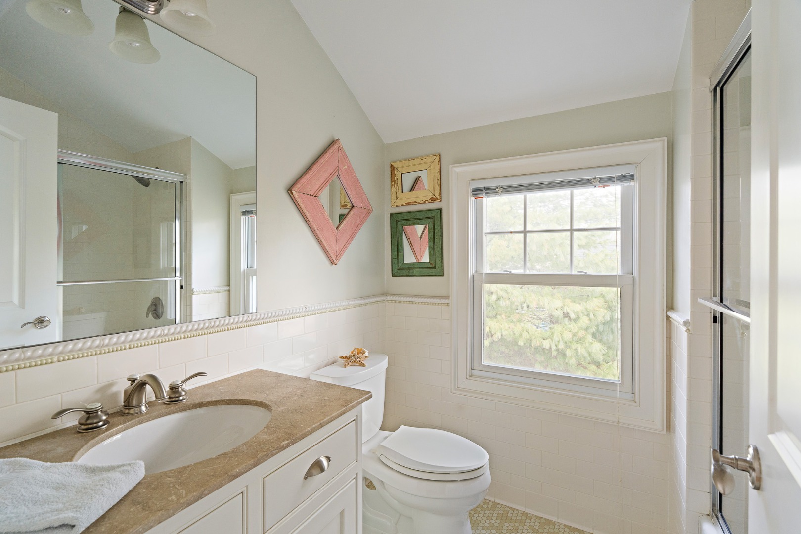 385 Barnes Road Oak Bluffs, MA 02557 - Photo 40 of 60 a bathroom with a granite countertop sink toilet and a mirror