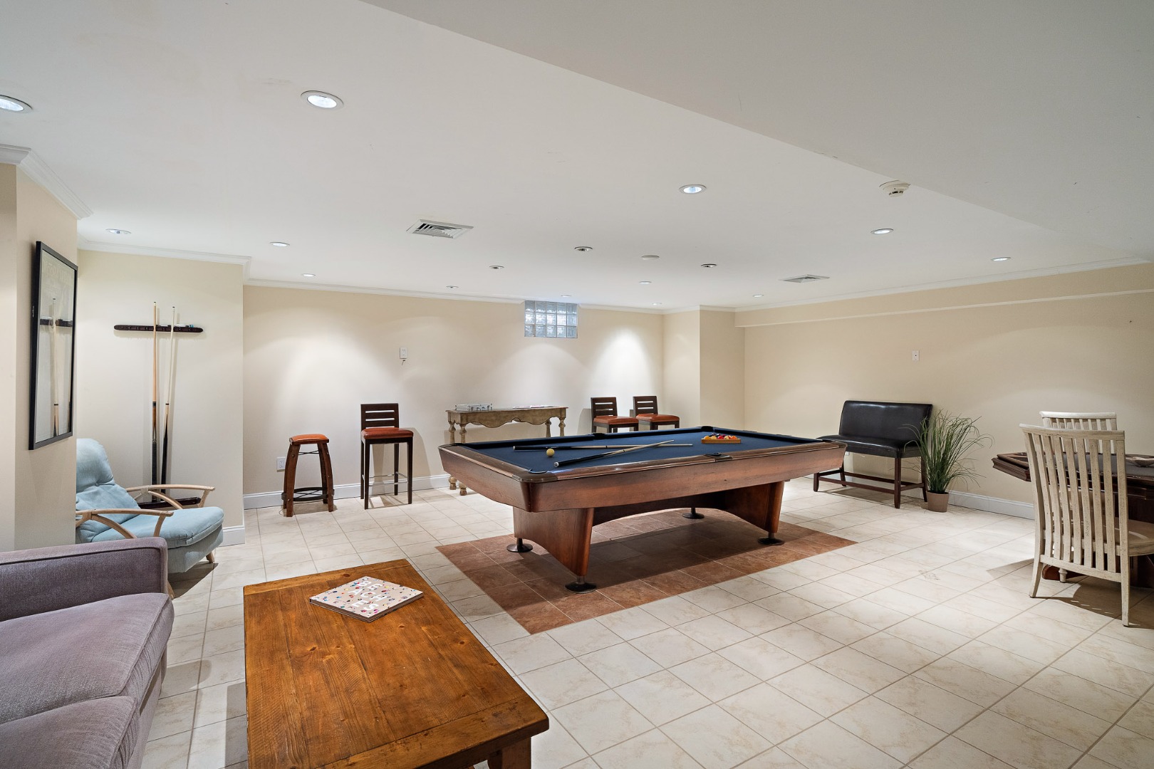 385 Barnes Road Oak Bluffs, MA 02557 - Photo 44 of 60 a living room with furniture a rug and white walls