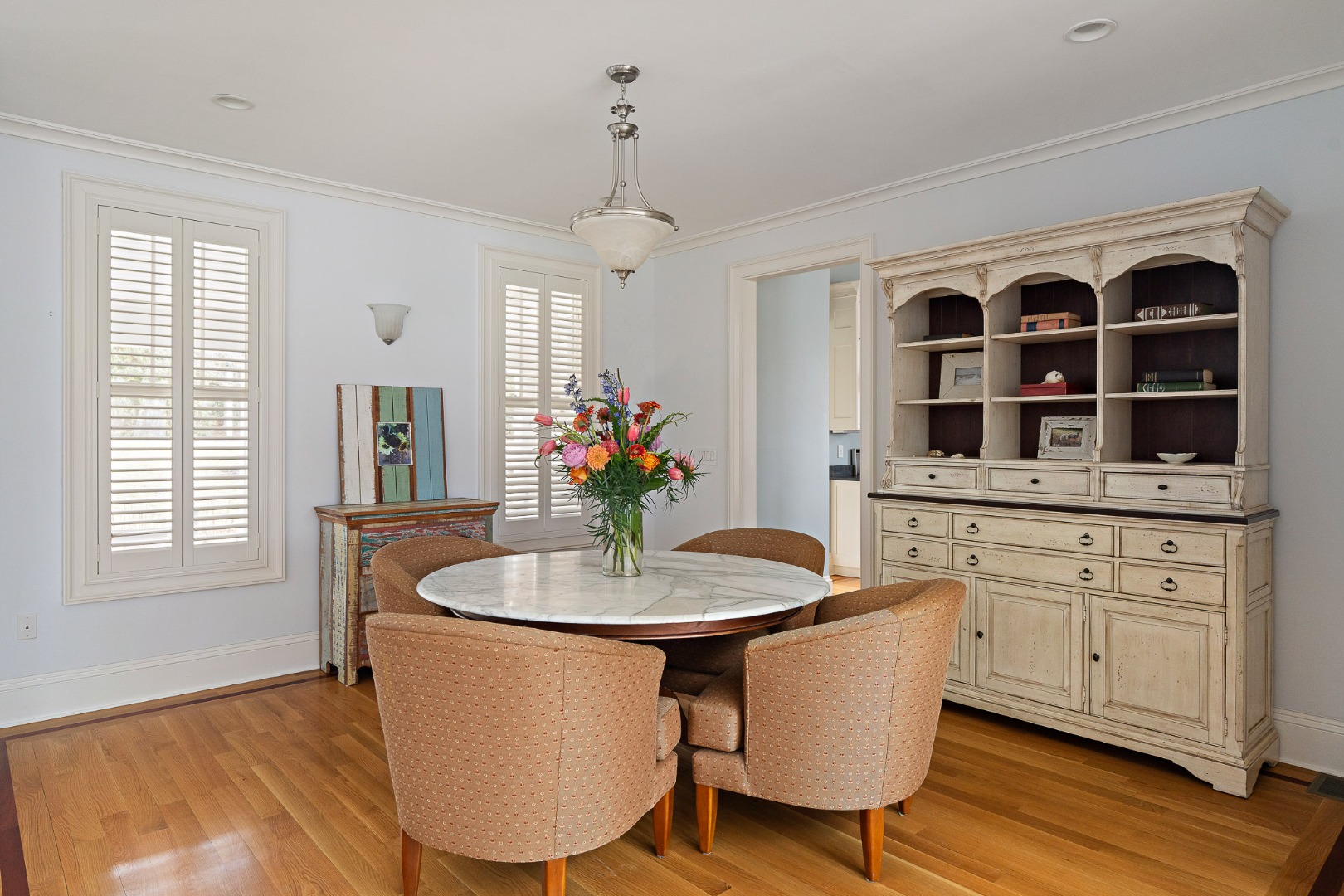 385 Barnes Road Oak Bluffs, MA 02557 - Photo 8 of 60 a dining room with furniture a window and wooden floor