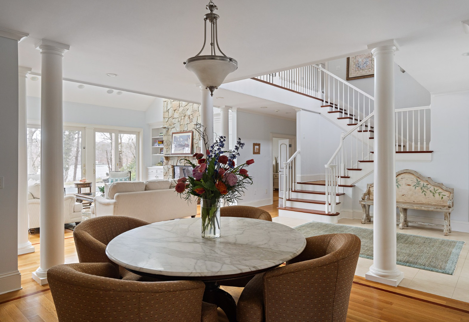 385 Barnes Road Oak Bluffs, MA 02557 - Photo 9 of 60 a living room with furniture and a table